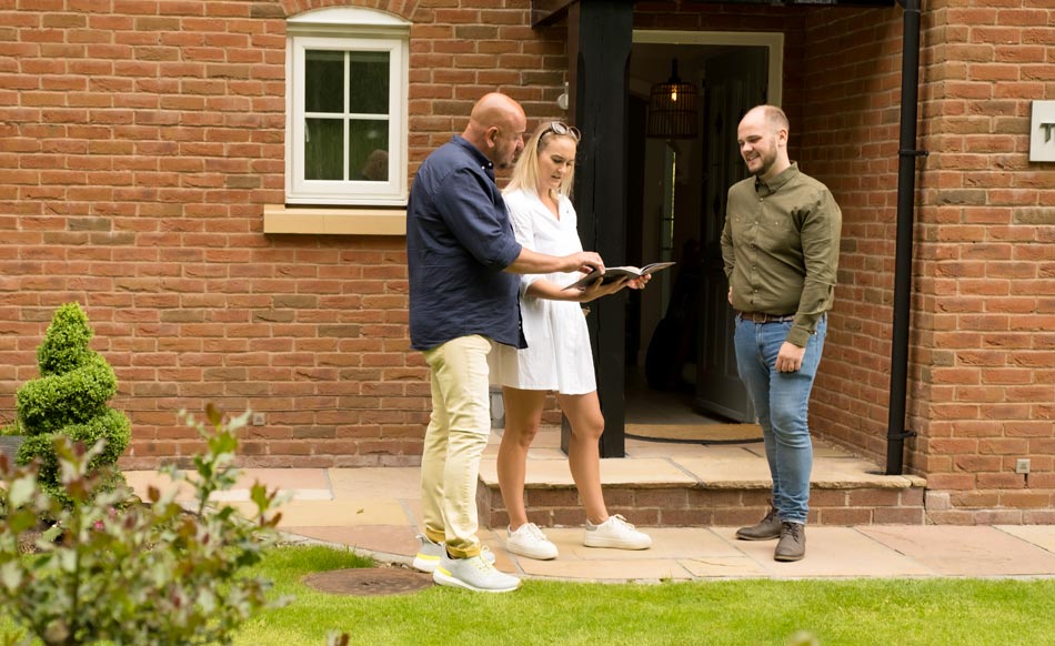 Aidan Flanagan operations manager of Ian Storey, Director of Storeys Of Cheshire Luxury Estate Agents showing a couple around a unique property